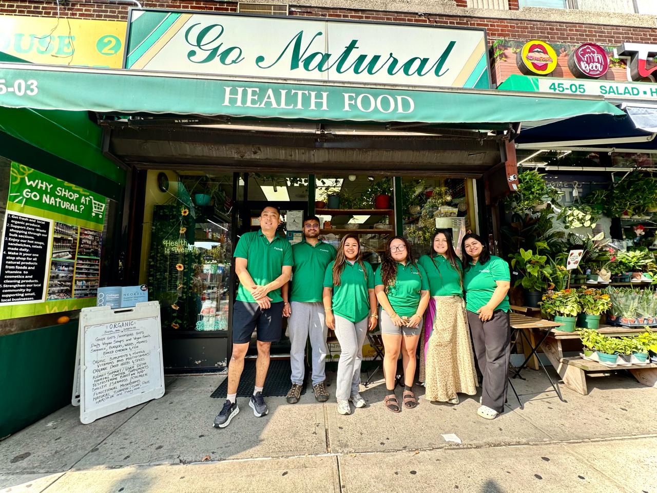 The Go Natural NY team standing outside the store on Queens Boulevard in Sunnyside